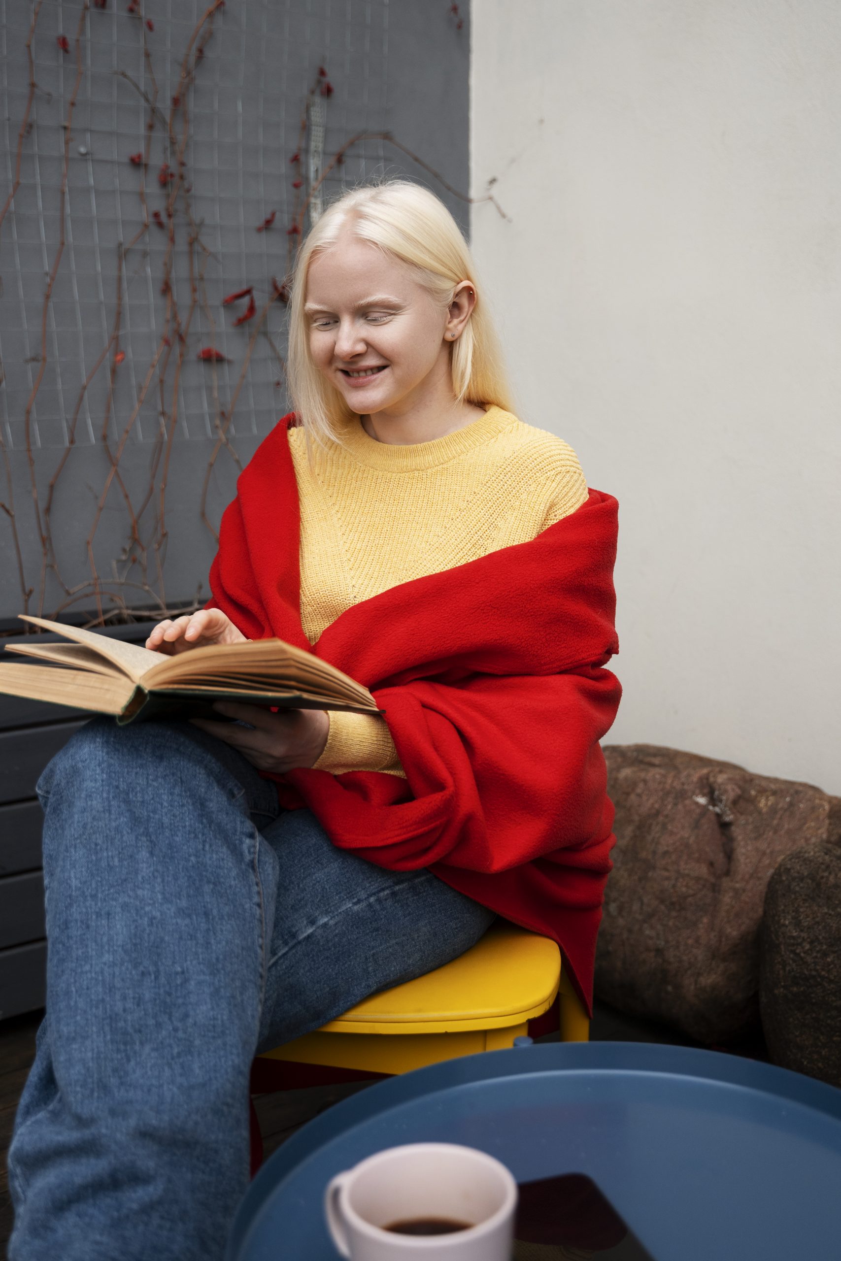 side view albino woman reading