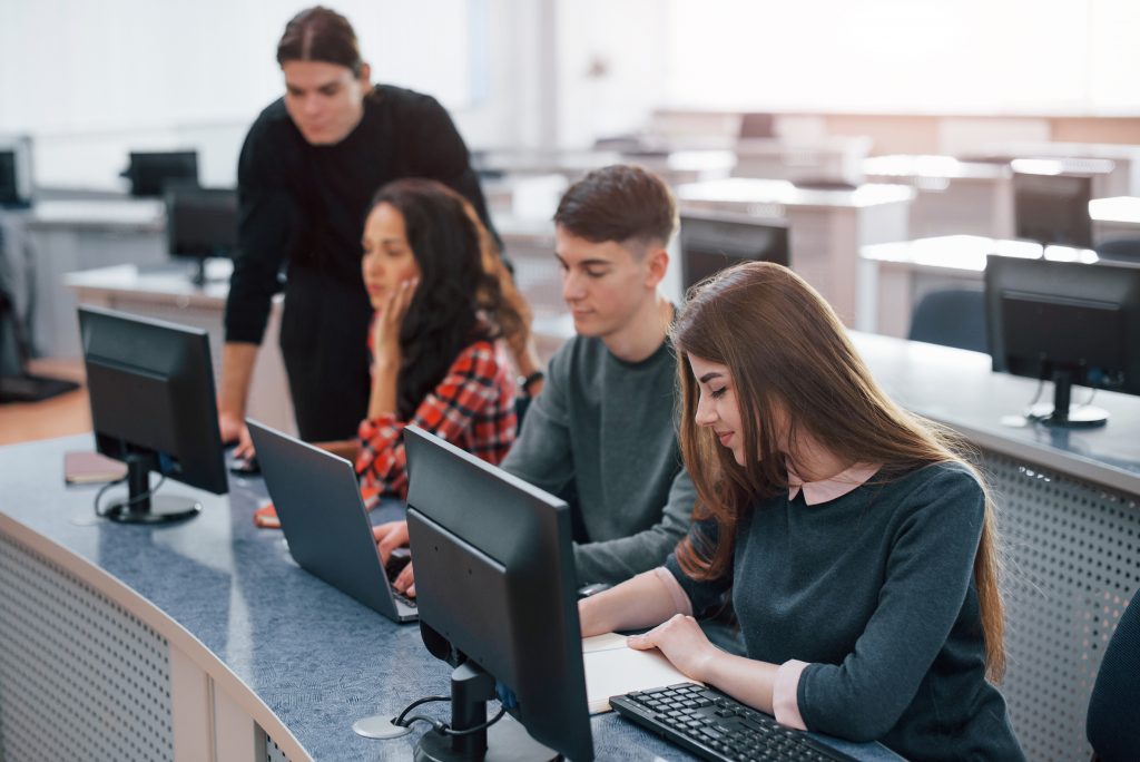 spacious area. group of young people in casual clothes working in the modern office
